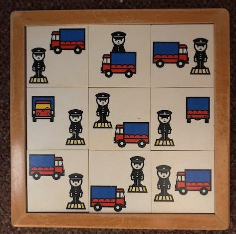 Educo Begrippen Lotto Voorzetsels met een vrachtwagen en een politieagent.