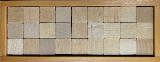 Fröbel speelgaven in een houten kistje